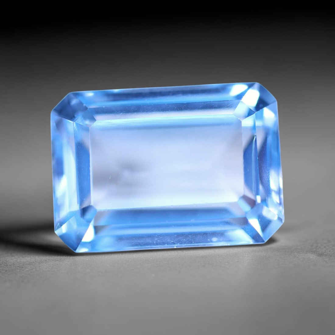 10.77 carats Natural Swiss Blue Topaz - 14.2x10.1x6.8mm , 831C: Ksmith Heritage Auctioneers Subject: Natural Topaz Treatment: Irradiated Type: Faceted, Polished