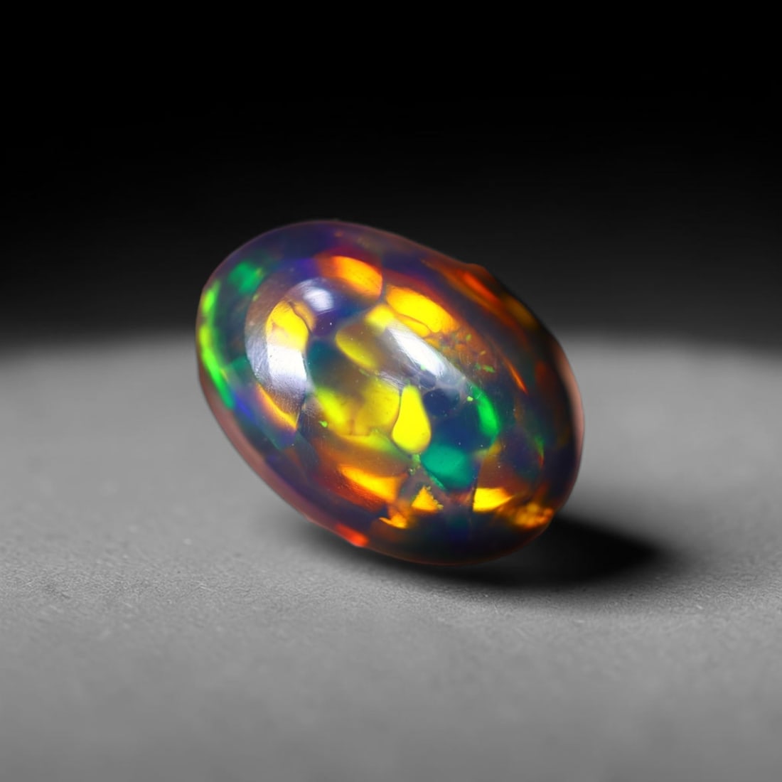 *1.66Ct Smoked Welo Opal Polished - Ethiopian Opal , 305C: Ksmith Heritage Auctioneers Subject: Natural Ethiopian Welo Opal Origin: Ethiopia Carat Weight: 1.66Ct Dimension: 11x7.8x3.9 mm Treatment: Smoked Type: Cabochon, Polished<
