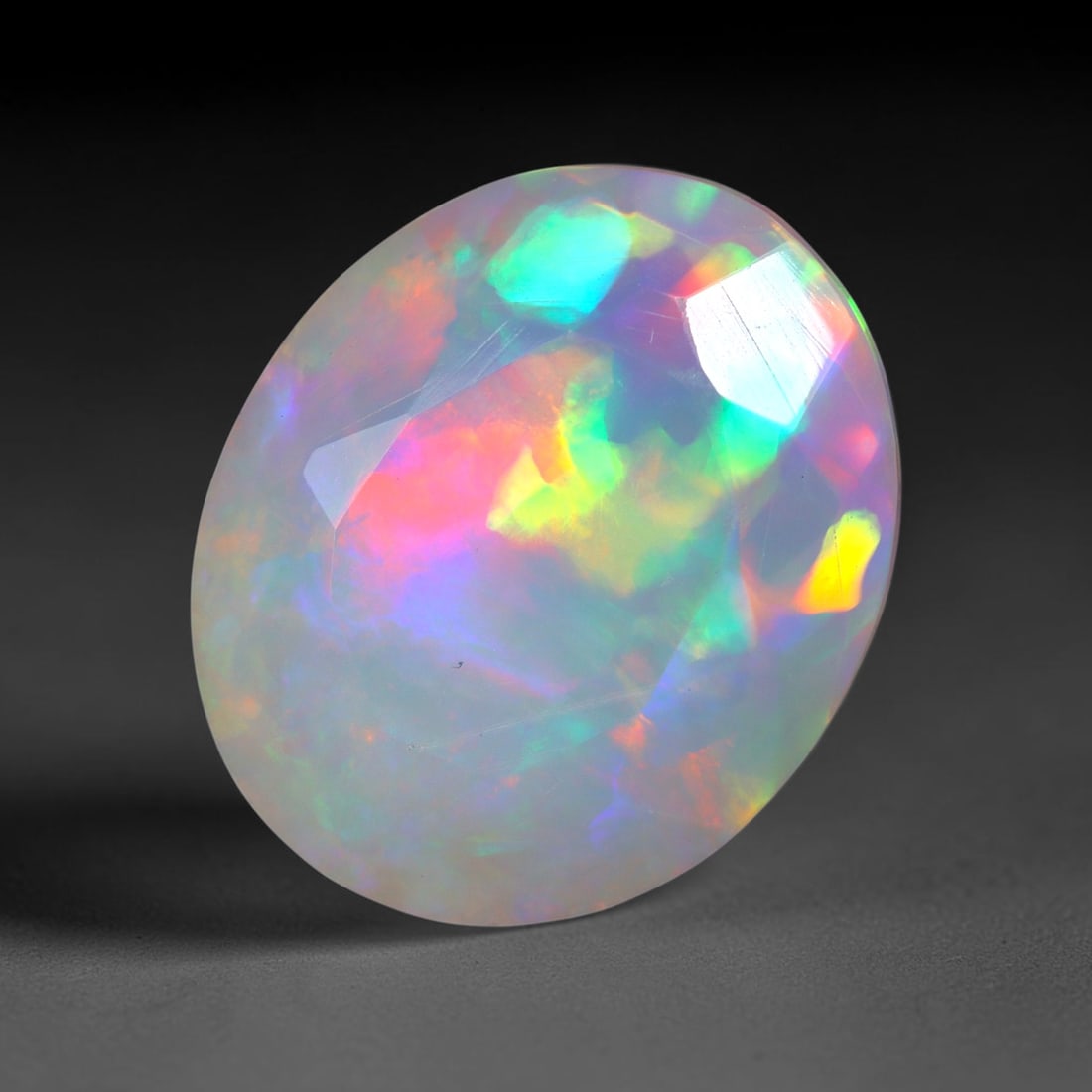 3.07Ct Natural Ethiopian Opal, Faceted Cut - 12.1x10.1x5.4 mm , 672C: Ksmith Heritage Auctioneers Subject: Natural Ethiopian Welo Opal Origin: Ethiopia Treatment: Unheated