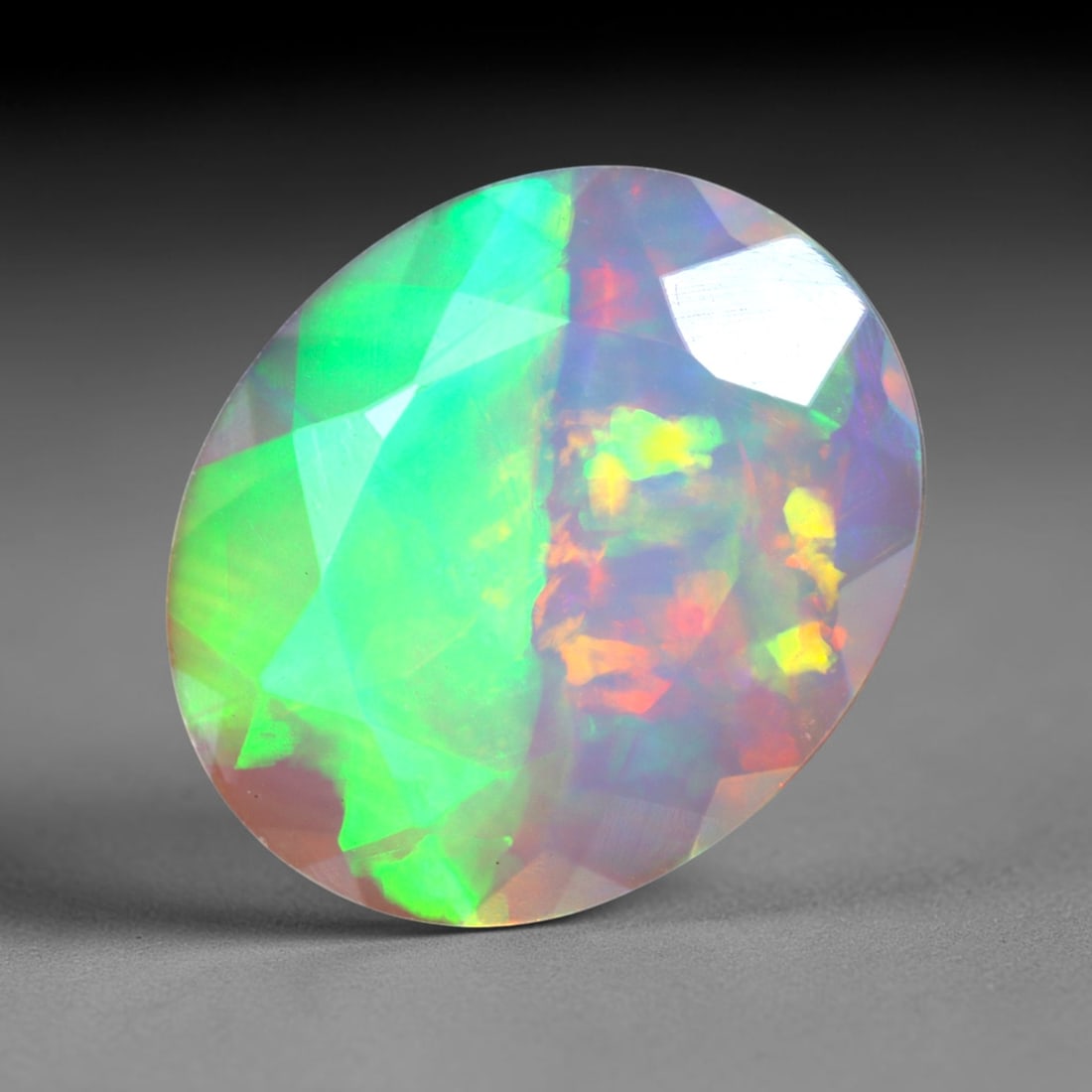 2.12Ct Natural Ethiopian Opal, Faceted Cut - 12.0x10.0x4.1 mm , 639C: Ksmith Heritage Auctioneers Subject: Natural Ethiopian Welo Opal Origin: Ethiopia Treatment: Unheated