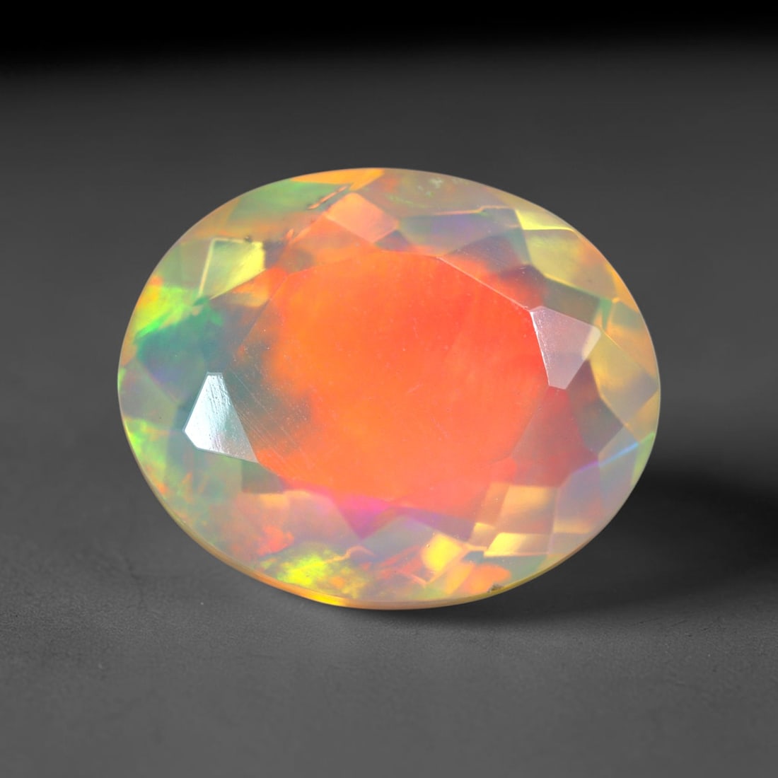 2.47Ct Natural Ethiopian Opal, Faceted Cut - 11.1x9.0x5.5 mm , 665C: Ksmith Heritage Auctioneers Subject: Natural Ethiopian Welo Opal Origin: Ethiopia Treatment: Unheated