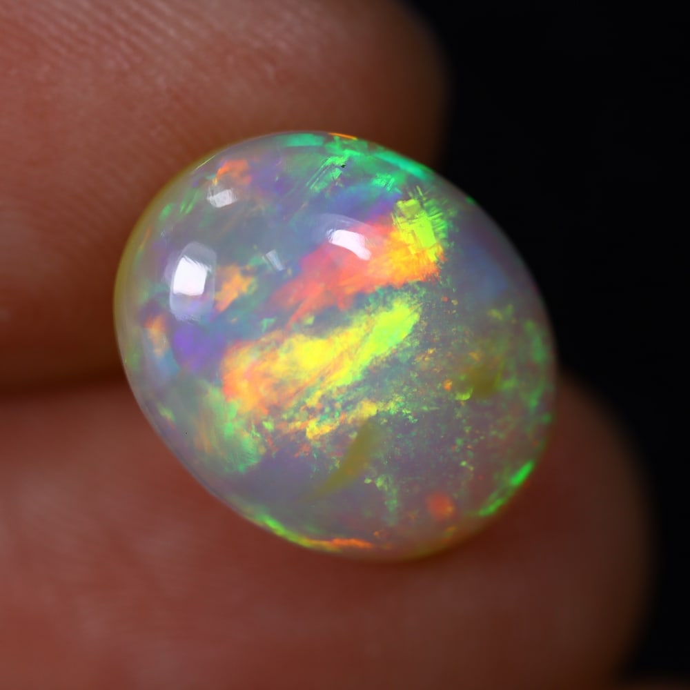 *4.55Ct Welo Opal Polished - Ethiopian Opal , 460C: Ksmith Heritage Auctioneers Subject: Natural Ethiopian Welo Opal Origin: Ethiopia Carat Weight: 4.55Ct Dimension: 13.8x11.2x5.9 mm Treatment: Natural Untreated Type: Caboc