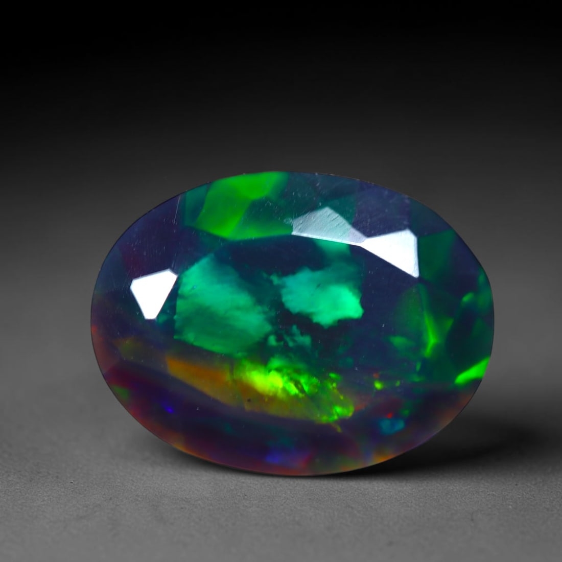 2.54Ct Natural Smoked Ethiopian Black Opal, Faceted Cut - 12.3x9.3x5.5 mm , 705C: Ksmith Heritage Auctioneers Subject: Natural Ethiopian Welo Opal Origin: Ethiopia Treatment: Smoked