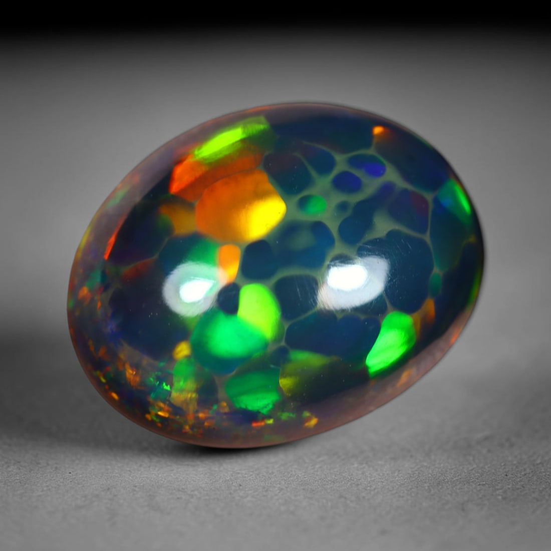 1.83Ct Natural Ethiopian Black Opal - 11.0x8.7x4.3 mm , 802C: Ksmith Heritage Auctioneers Subject: Natural Ethiopian Welo Opal Origin: Ethiopia Treatment: Smoked