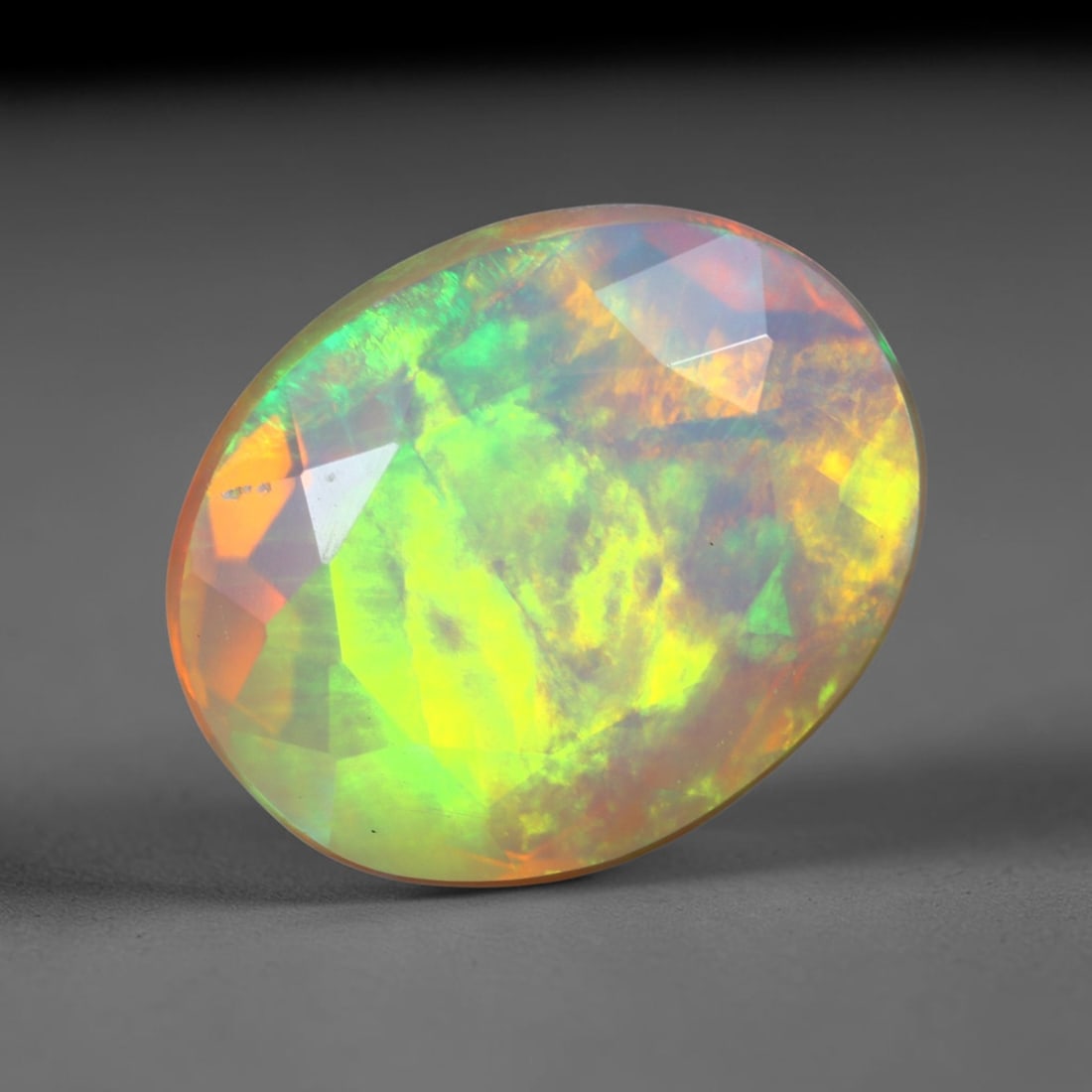 3.21Ct Natural Ethiopian Opal, Faceted Cut - 10.8x8.8x6.4 mm , 673C: Ksmith Heritage Auctioneers Subject: Natural Ethiopian Welo Opal Origin: Ethiopia Treatment: Unheated