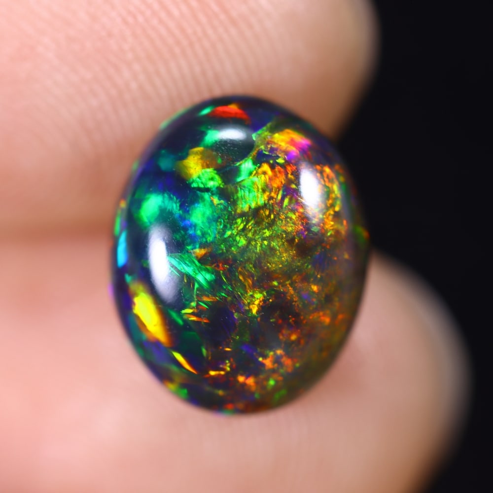 2.85Ct Natural Ethiopian Black Opal - 11.6x9.4x5.4 mm , 598C: Ksmith Heritage Auctioneers Subject: Natural Ethiopian Welo Opal Origin: Ethiopia Treatment: Smoked