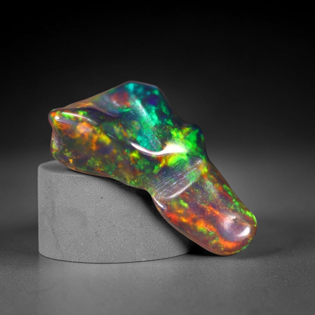 *1.78Ct Smoked Freeform Welo Opal Polished - Ethiopian Opal , 207C: Ksmith Heritage Auctioneers Subject: Natural Ethiopian Welo Opal Origin: Ethiopia Carat Weight: 1.78Ct Dimension: 14.4x8.4x4 mm Treatment: Smoked Type: Freeform, Polished<