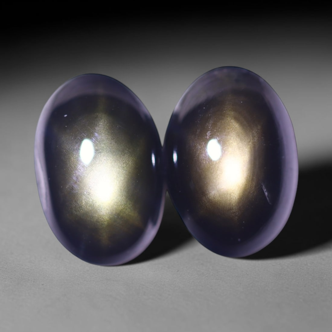 3.21cts 6 Rays Black Star Sapphire Pair , 868E: Ksmith Heritage Auctioneers Subject: Natural 6 Rays Star Sapphire Origin: Myanmar Carat Weight: 3.21cts Dimension: 7.8x5.3x3.3 mm Treatment: Diffusion Type: Cabochon, Poli