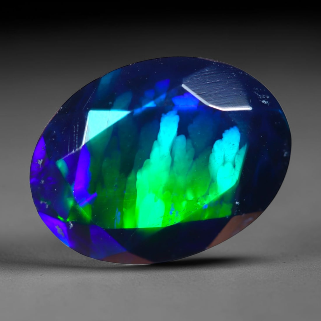 2.42Ct Natural Smoked Ethiopian Black Opal, Faceted Cut - 11.5x8.8x5.5 mm , 711C: Ksmith Heritage Auctioneers Subject: Natural Ethiopian Welo Opal Origin: Ethiopia Treatment: Smoked