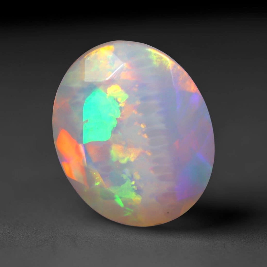 3.13Ct Natural Ethiopian Opal, Faceted Cut - 12.1x10.0x6.2 mm , 670C: Ksmith Heritage Auctioneers Subject: Natural Ethiopian Welo Opal Origin: Ethiopia Treatment: Unheated