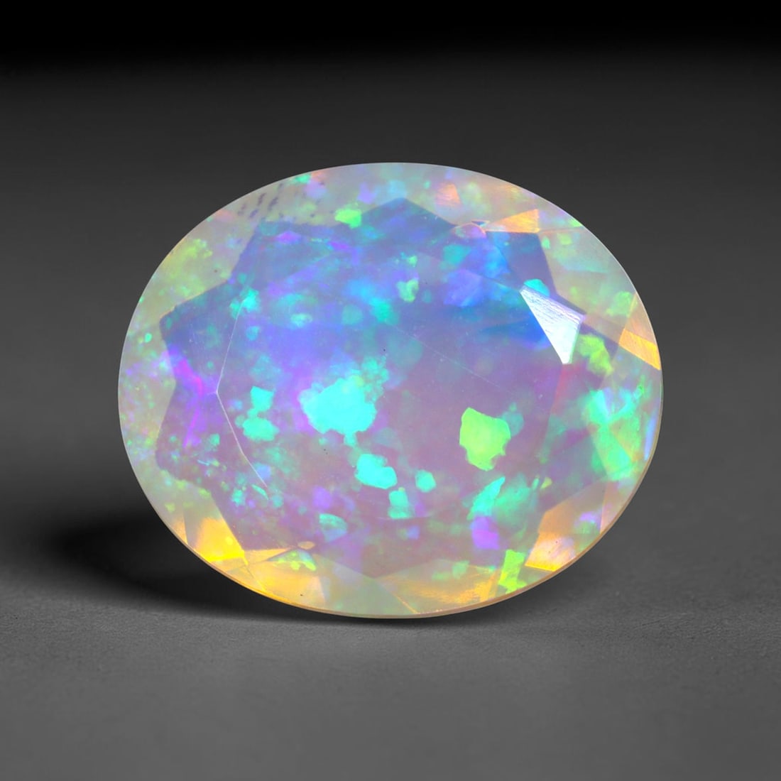 2.73Ct Natural Ethiopian Opal, Faceted Cut - 12.0x10.0x4.9 mm , 633C: Ksmith Heritage Auctioneers Subject: Natural Ethiopian Welo Opal Origin: Ethiopia Treatment: Unheated
