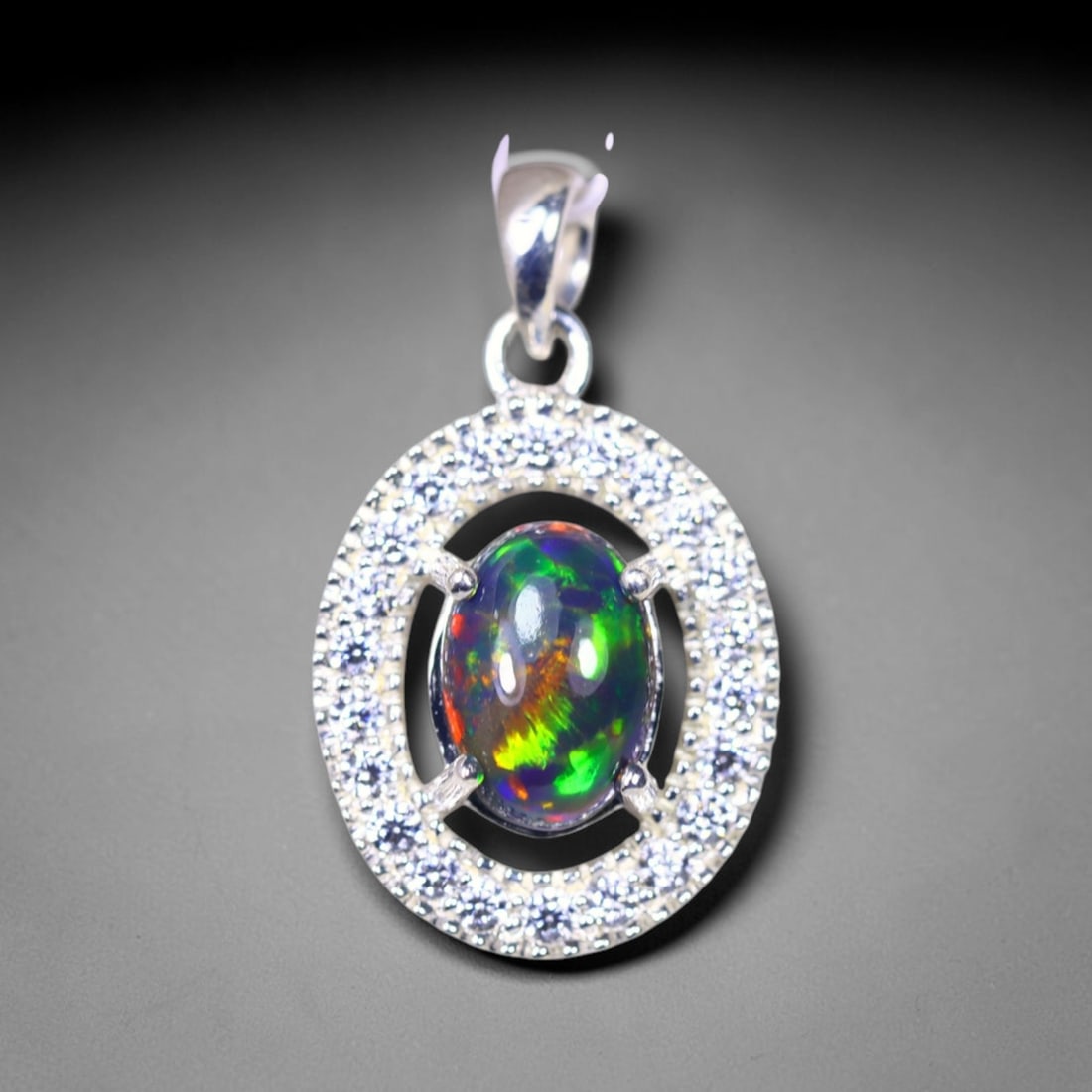 Silver Pendant with Ethiopian Black Opal 3.5grams - 925 Sterling Silver, 40B: Ksmith Heritage Auctioneers Subject: Opal & Simulated Diamond Silver Pendant Carat Weight: 3.5 grams (approx.) Dimension: Opal 10x7mm, Pendant 22x15mm