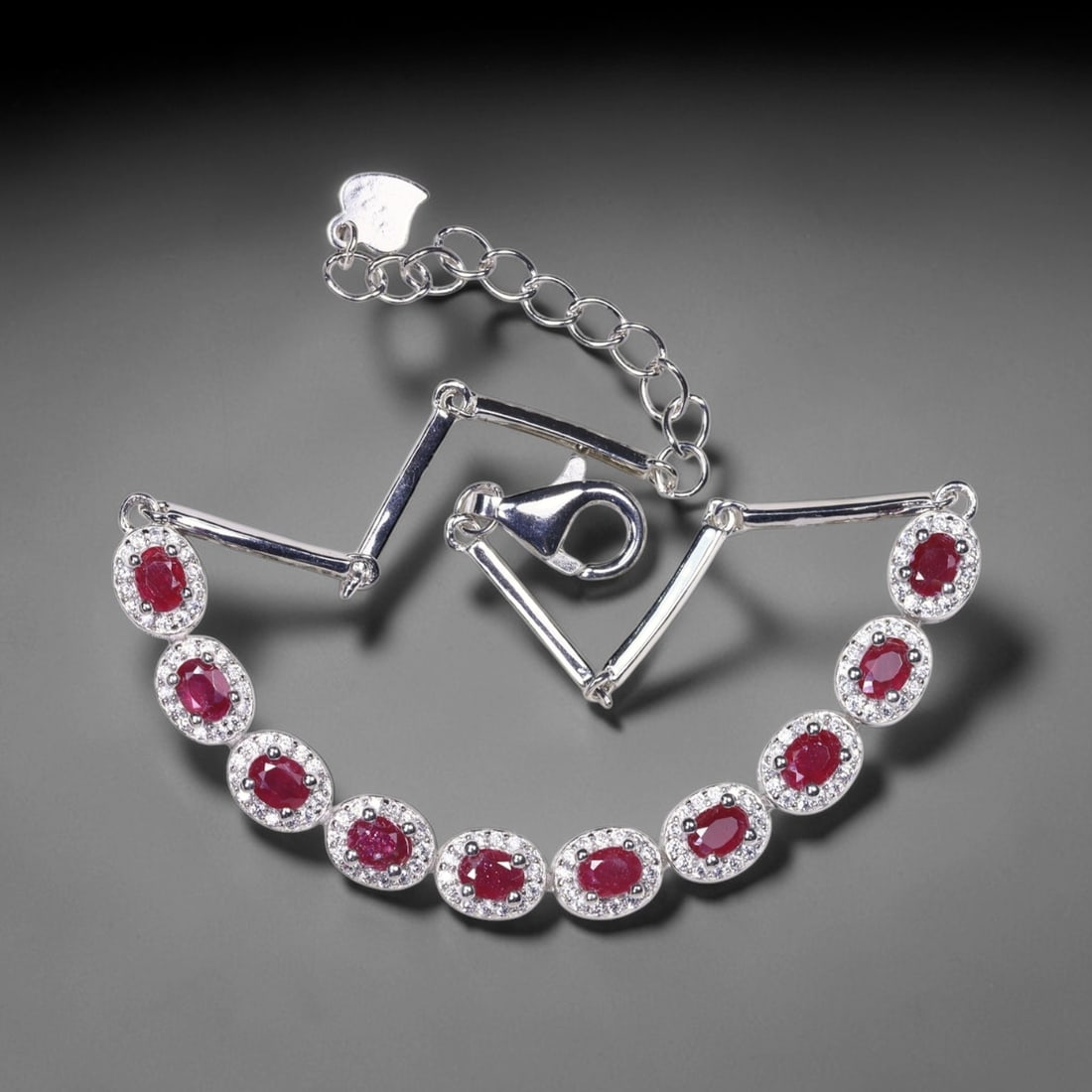 Ruby & Simulated CZ Bracelet- 925 Sterling Silver - Plated 14k White Gold , 299E: Ksmith Heritage Auctioneers Subject: Natural Ruby & Simulated CZ Origin: Thailand Carat Weight: 6.98g Dimension: Ruby 3x4mm Type: Bracelet