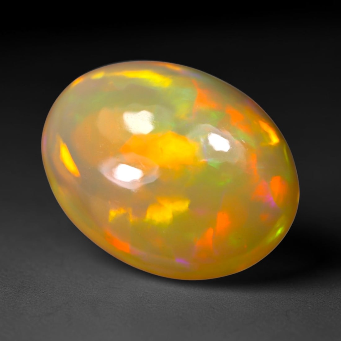 4.30Ct Welo Opal Polished - Ethiopian Opal, 944B: Ksmith Heritage Auctioneers Subject: Natural Ethiopian Welo Opal Origin: Ethiopia Carat Weight: 4.30Ct Dimension: 13.7x10.8x5.9 mm Treatment: Natural Untreated Type: Cabochon,