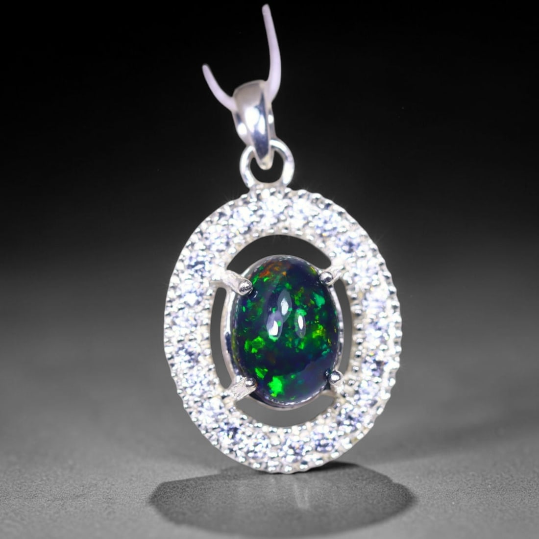 Silver Pendant with Ethiopian Black Opal 3.5grams - 925 Sterling Silver , 591E: Ksmith Heritage Auctioneers Subject: Opal & Simulated Diamond Silver Pendant Carat Weight: 3.5 grams (approx.) Dimension: Opal 10x7mm, Pendant 22x15mm