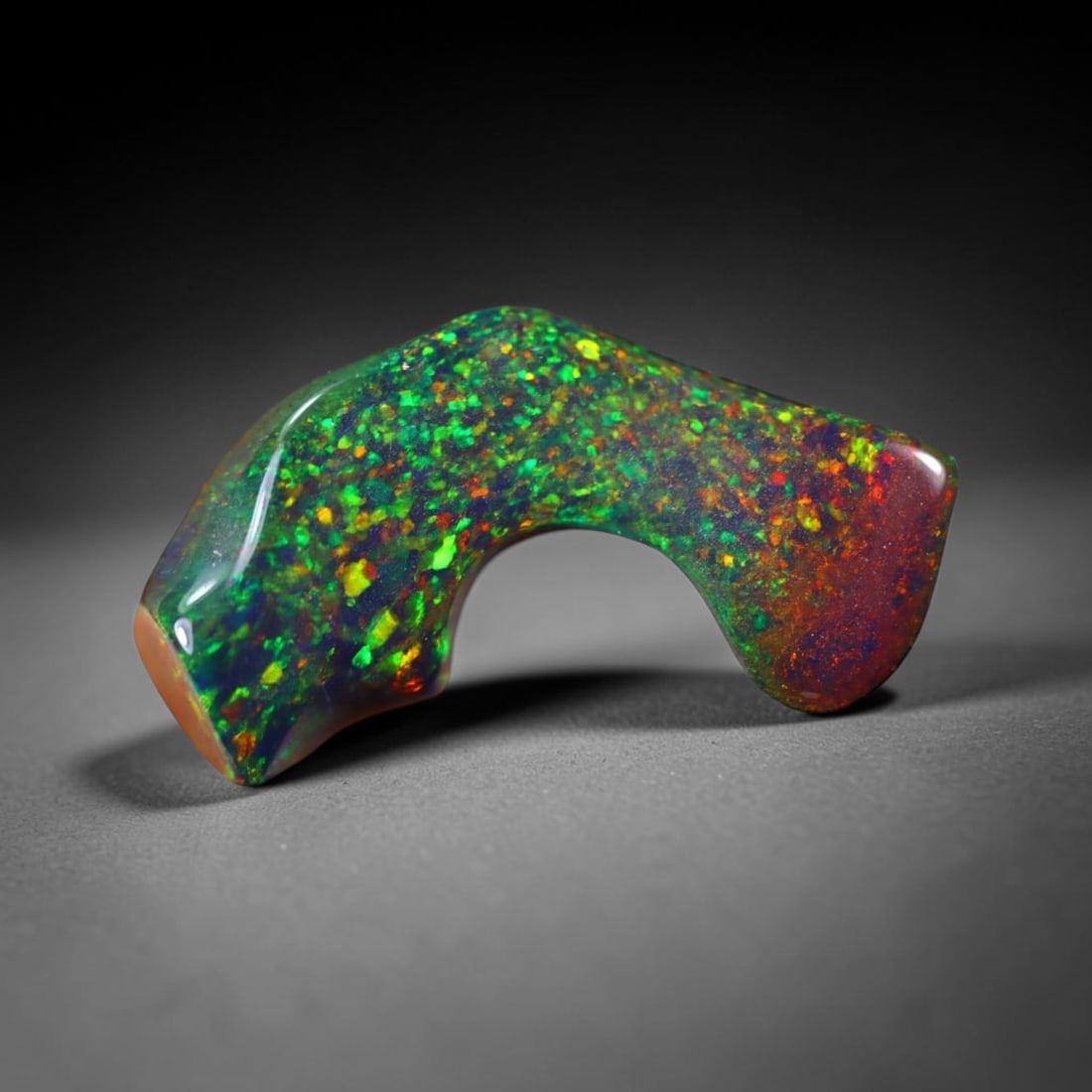 2.41Ct Natural Freeform Black Opal - 17x9x4mm - Polished Rough , 2E: Ksmith Heritage Auctioneers Subject: Natural Opal Origin: Ethiopia Treatment: Smoked Shape: Freeform Type: Polished Rough