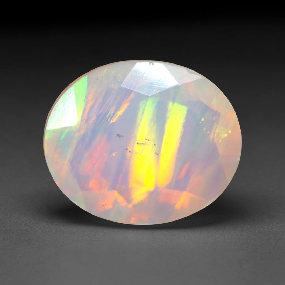 2.87Ct Natural Ethiopian Opal, Faceted Cut - 12.0x10.0x5.9 mm , 677C: Ksmith Heritage Auctioneers Subject: Natural Ethiopian Welo Opal Origin: Ethiopia Treatment: Unheated