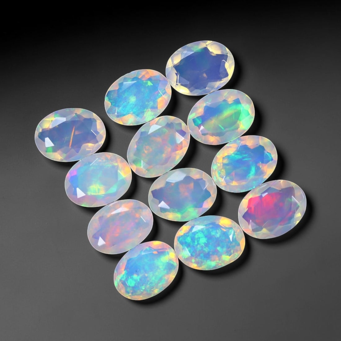*8.86Ct 12pcs Calibrated 8x6mm Faceted Welo Opal Set - Ethiopian Opal, 727B: Ksmith Heritage Auctioneers Subject: Natural Ethiopian Welo Opal Origin: Ethiopia Carat Weight: 8.86Ct Treatment: Natural Untreated Type: Faceted, Polished