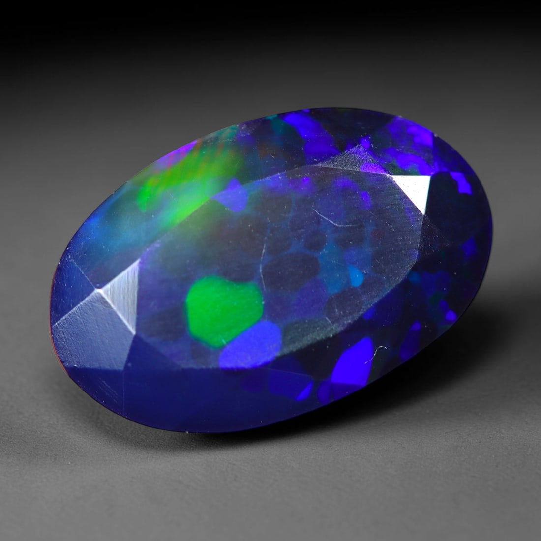 2.40Ct Natural Smoked Ethiopian Black Opal, Faceted Cut - 12.6x8.1x5.2 mm , 717C: Ksmith Heritage Auctioneers Subject: Natural Ethiopian Welo Opal Origin: Ethiopia Treatment: Smoked