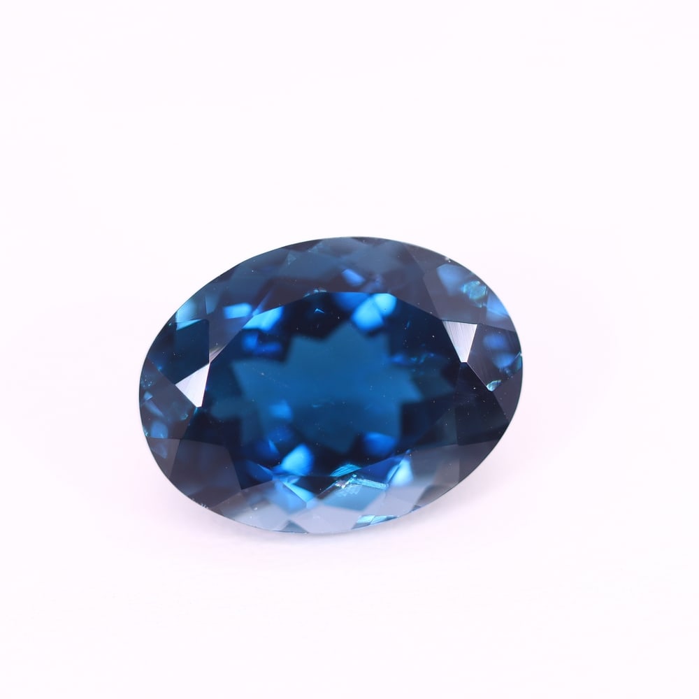 *12.77Ct London Blue Topaz - Polished Faceted , 213C: Ksmith Heritage Auctioneers Subject: Natural Blue Topaz Origin: Myanmar Carat Weight: 12.77Ct Dimension: 16.1x12.1x8.4 mm Treatment: Irridiated Type: Faceted, Polished