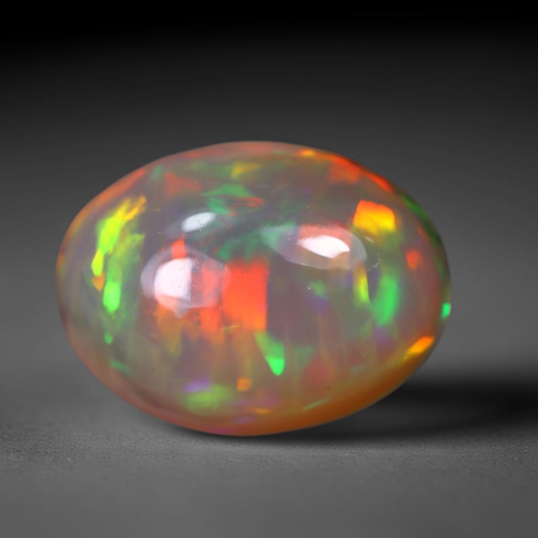 4.04Ct Welo Opal Polished - Ethiopian Opal, 1068B: Ksmith Heritage Auctioneers Subject: Natural Ethiopian Welo Opal Origin: Ethiopia Carat Weight: 4.04Ct Dimension: 14.2x10.4x6.2 mm Treatment: Natural Untreated Type: Cabochon,