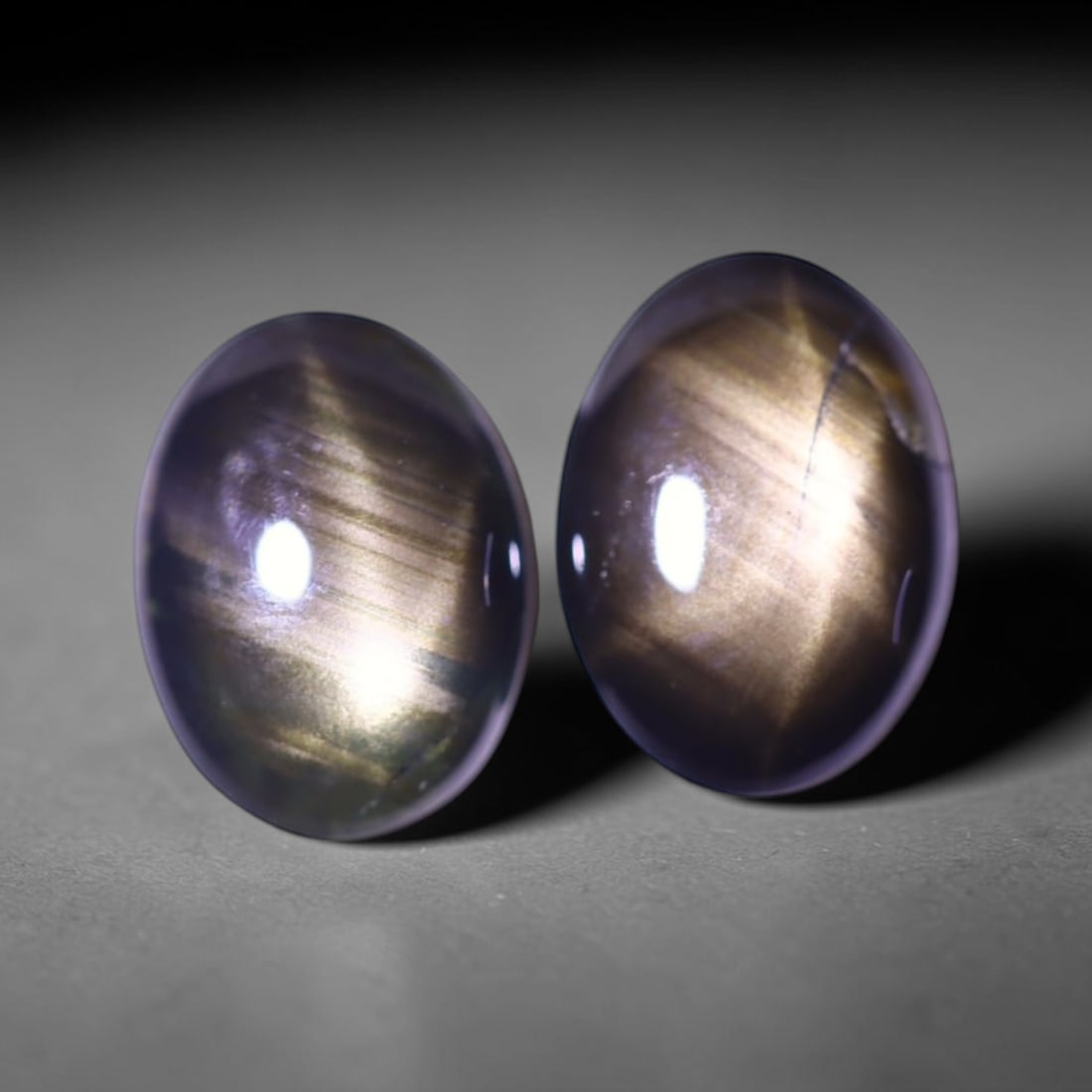 2.28cts 6 Rays Black Star Sapphire Pair , 318E: Ksmith Heritage Auctioneers Subject: Natural 6 Rays Star Sapphire Origin: Myanmar Carat Weight: 2.28cts Dimension: 7.4x5.5x2.5 mm Treatment: Diffusion Type: Cabochon, Poli