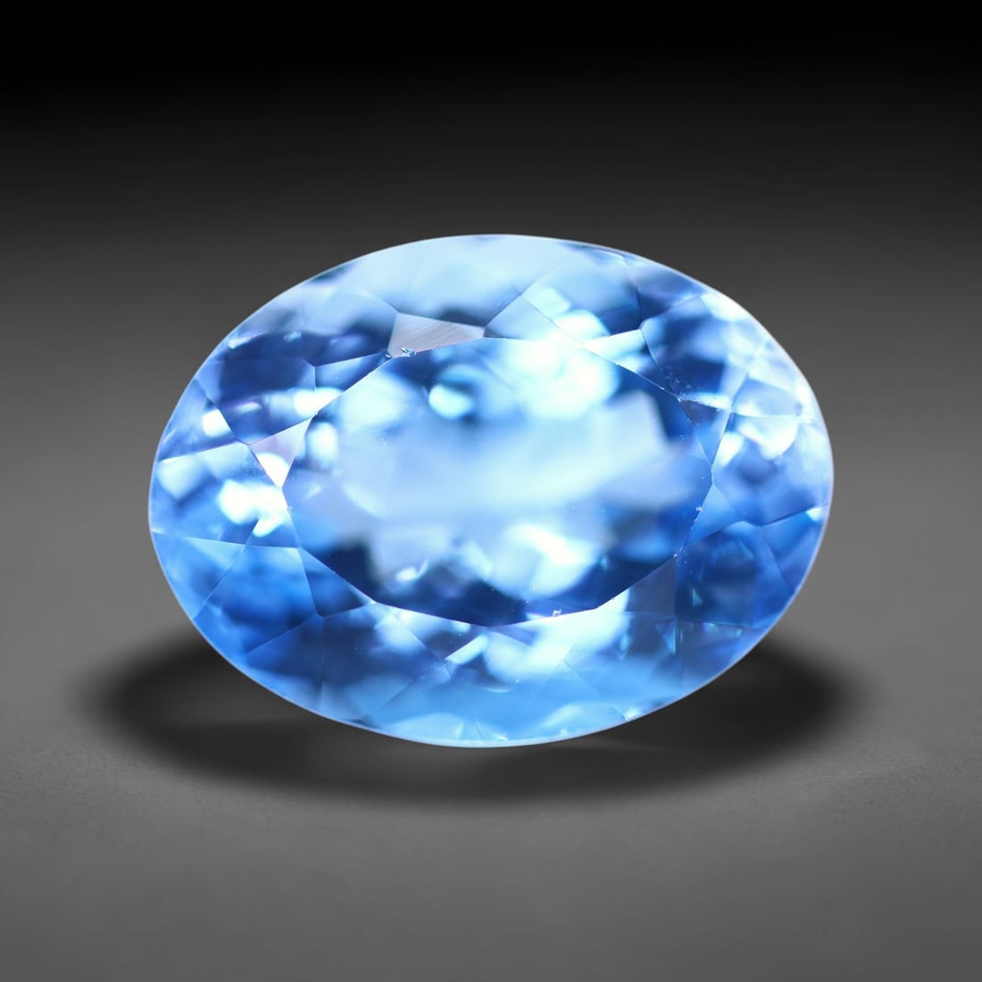 12.86 carats Natural Swiss Blue Topaz - 16x12x8.7mm , 846C: Ksmith Heritage Auctioneers Subject: Natural Topaz Treatment: Irradiated Type: Faceted, Polished