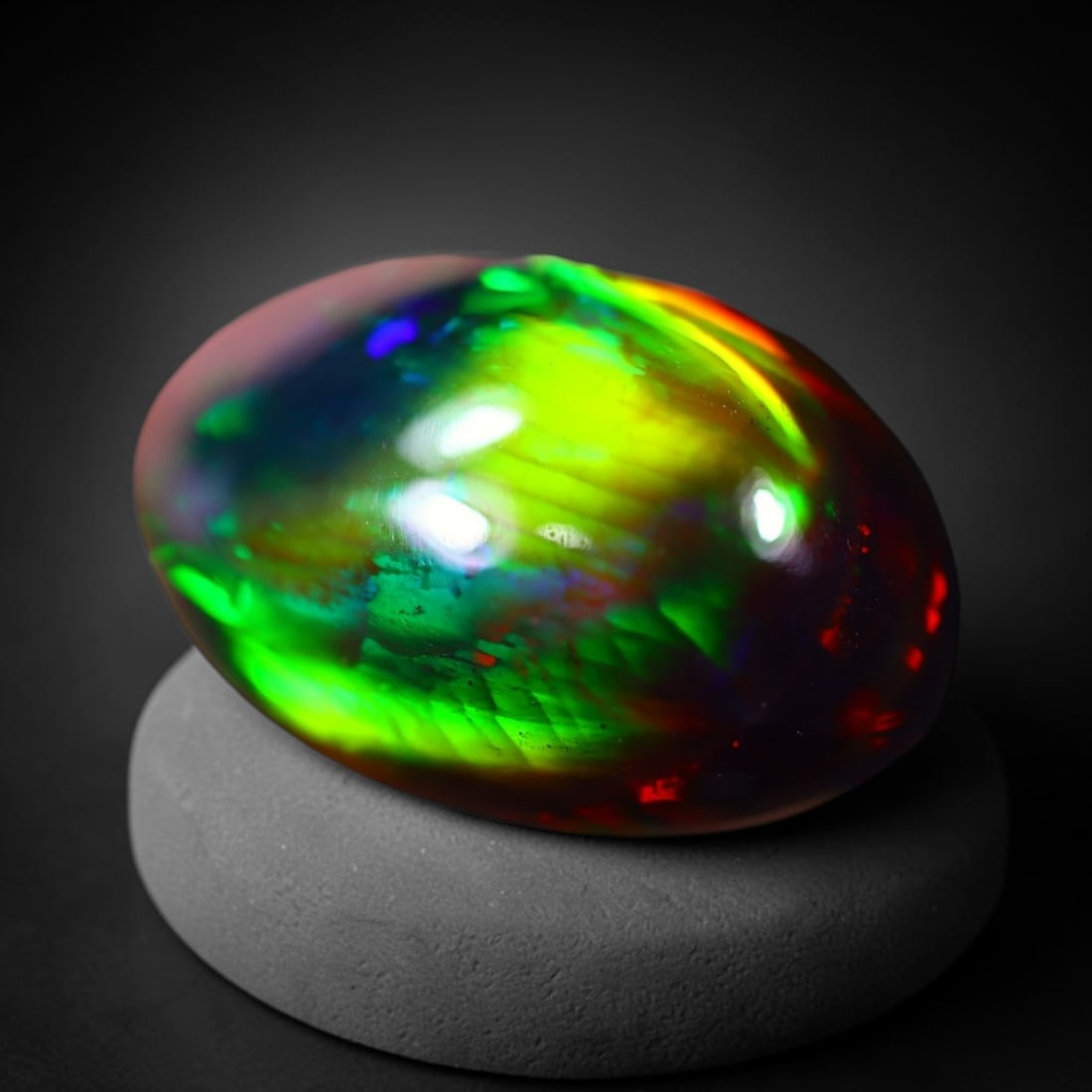 *9.93Ct Welo Black Opal Polished - Ethiopian Opal - Oval Cabochon , 64E: Ksmith Heritage Auctioneers Subject: Natural Ethiopian Welo Black Opal Origin: Ethiopia Carat Weight: 9.93Ct Dimension: 18.8 x 12.2 x 8.5 mm Treatment: Smoked Shape: Oval<