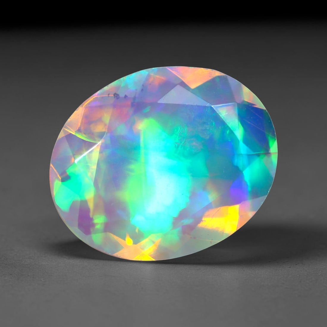 1.76Ct Natural Ethiopian Opal, Faceted Cut - 11.0x9.6x3.8 mm , 642C: Ksmith Heritage Auctioneers Subject: Natural Ethiopian Welo Opal Origin: Ethiopia Treatment: Unheated
