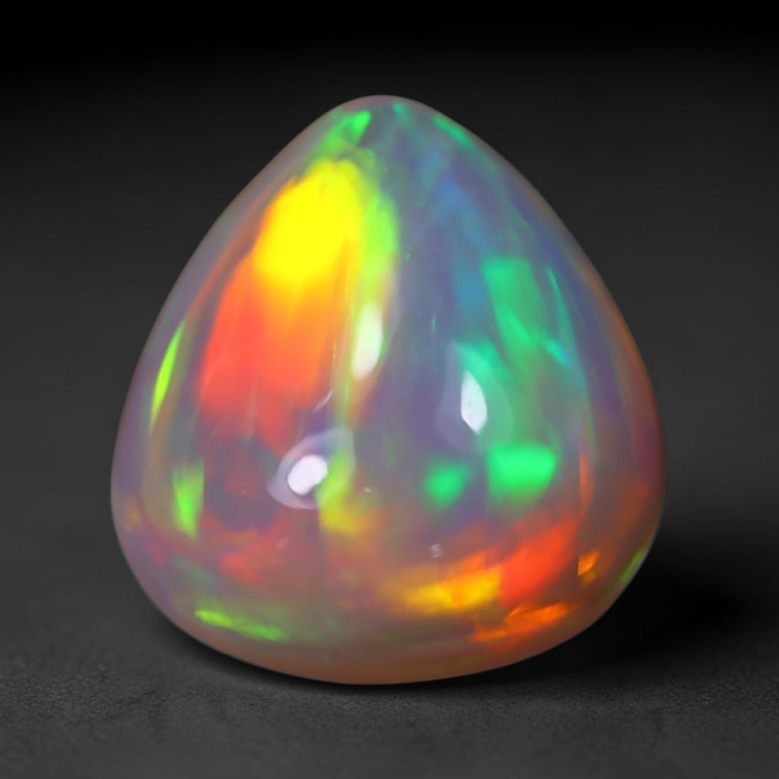 *6.31Ct Welo Opal Polished - Ethiopian Opal, 265B: Ksmith Heritage Auctioneers Subject: Natural Ethiopian Welo Opal Origin: Ethiopia Carat Weight: 6.31Ct Dimension: 14.3x13.4x7.4 mm Treatment: Natural Untreated Type: Cabochon,