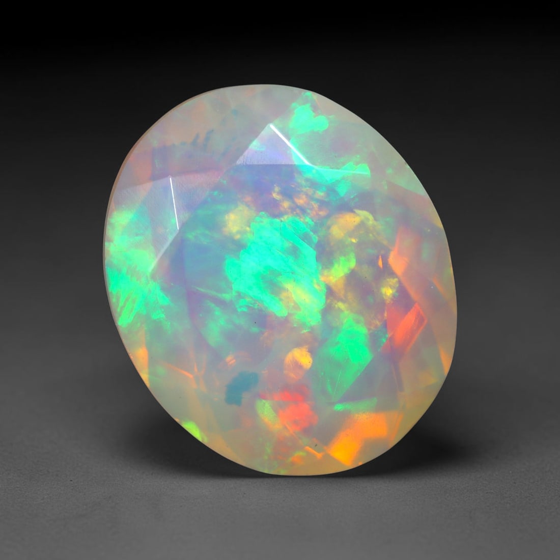 2.91Ct Natural Ethiopian Opal, Faceted Cut - 12.0x10.0x5.8 mm , 663C: Ksmith Heritage Auctioneers Subject: Natural Ethiopian Welo Opal Origin: Ethiopia Treatment: Unheated