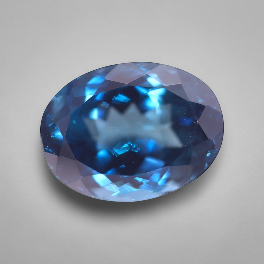 *13.84Ct London Blue Topaz - Polished Faceted , 214C: Ksmith Heritage Auctioneers Subject: Natural Blue Topaz Origin: Myanmar Carat Weight: 13.84Ct Dimension: 15.8x11.9x9.1 mm Treatment: Irridiated Type: Faceted, Polished