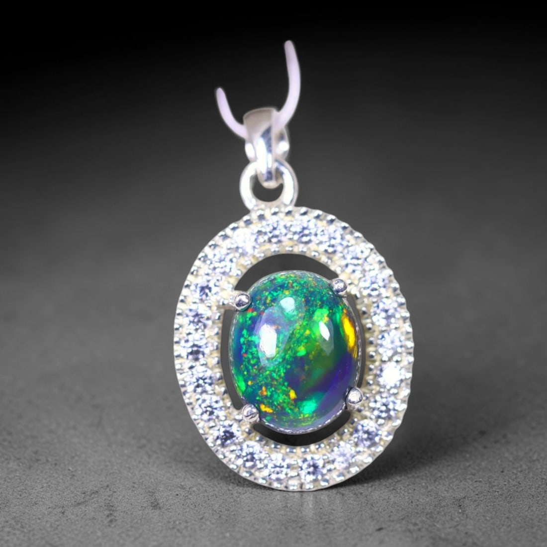 Silver Pendant with Ethiopian Black Opal 3.5grams - 925 Sterling Silver, 1086B: Ksmith Heritage Auctioneers Subject: Opal & Simulated Diamond Silver Pendant Carat Weight: 3.5 grams (approx.) Dimension: Opal 10x7mm, Pendant 22x15mm