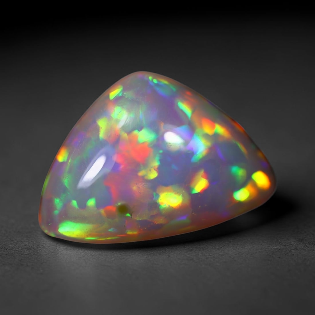 *5.35Ct Welo Opal Polished - Ethiopian Opal , 42E: Ksmith Heritage Auctioneers Subject: Natural Ethiopian Welo Opal Origin: Ethiopia Carat Weight: 5.35Ct Dimension: 16.5x10.4x6.4 mm Treatment: Natural Untreated Type: Caboc
