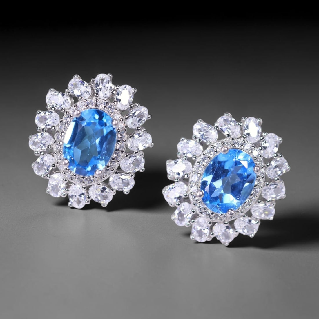 Earrings Swiss Blue Topaz & Simulated CZ - 925 Sterling Silver, 125B: Ksmith Heritage Auctioneers Subject: Natural Swiss Blue Topaz & Simulated CZ Origin: Thailand Carat Weight: 4.52g Dimension: Gemstone 6x8mm Type: Earrings