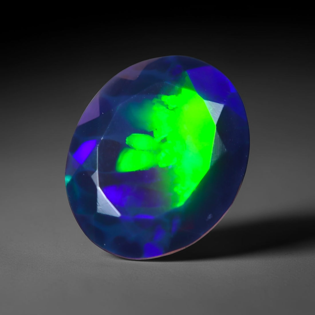 2.23Ct Natural Smoked Ethiopian Black Opal, Faceted Cut - 11.5x9.4x5.3 mm , 730C: Ksmith Heritage Auctioneers Subject: Natural Ethiopian Welo Opal Origin: Ethiopia Treatment: Smoked