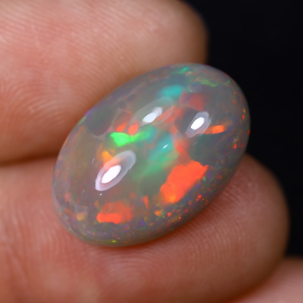 *9.89Ct Welo Opal Polished - Ethiopian Opal , 434C: Ksmith Heritage Auctioneers Subject: Natural Ethiopian Welo Opal Origin: Ethiopia Carat Weight: 9.89Ct Dimension: 18.5x12.7x8 mm Treatment: Natural Untreated Type: Cabochon, Polished