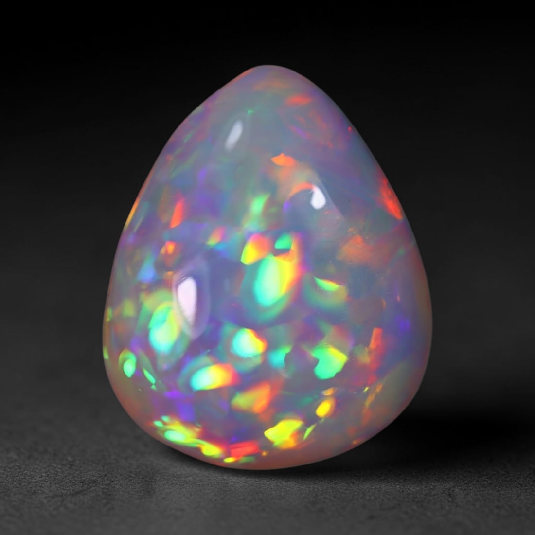 *8.73Ct Welo Opal Polished - Ethiopian Opal , 106E: Ksmith Heritage Auctioneers Subject: Natural Ethiopian Welo Opal Origin: Ethiopia Carat Weight: 8.73Ct Dimension: 18x14.7x6.6 mm Treatment: Natural Untreated Type: Cabocho