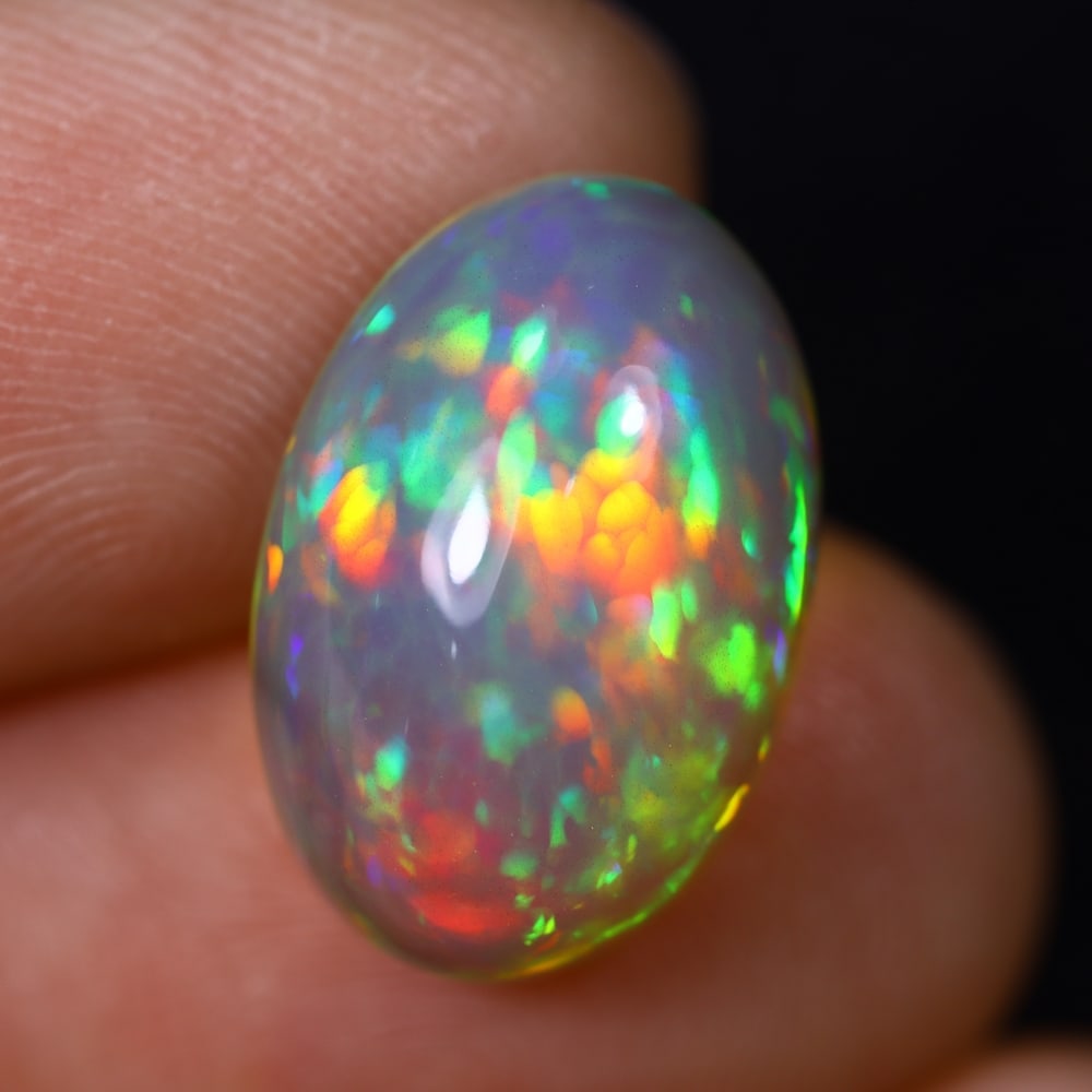 *6.56Ct Welo Opal Polished - Ethiopian Opal , 415C: Ksmith Heritage Auctioneers Subject: Natural Ethiopian Welo Opal Origin: Ethiopia Carat Weight: 6.56Ct Dimension: 16.1x11x7.6 mm Treatment: Natural Untreated Type: Cabocho