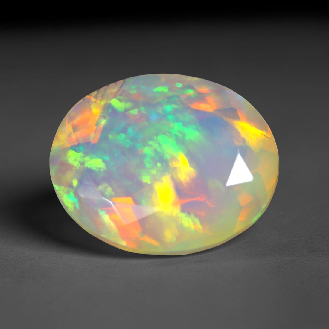 2.31Ct Natural Ethiopian Opal, Faceted Cut - 10.9x8.9x5.3 mm , 684C: Ksmith Heritage Auctioneers Subject: Natural Ethiopian Welo Opal Origin: Ethiopia Treatment: Unheated