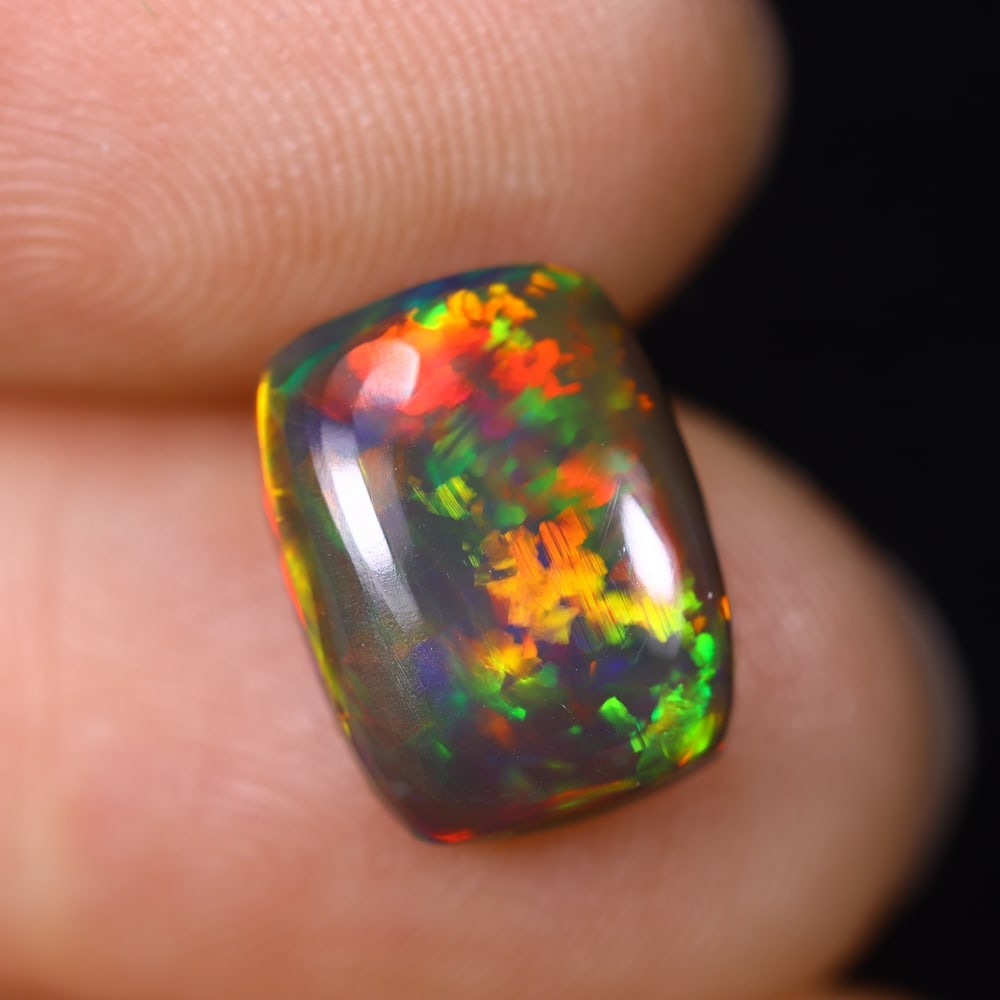 2.33Ct Natural Ethiopian Black Opal - 11.1x8.4x3.8 mm , 616C: Ksmith Heritage Auctioneers Subject: Natural Ethiopian Welo Opal Origin: Ethiopia Treatment: Smoked