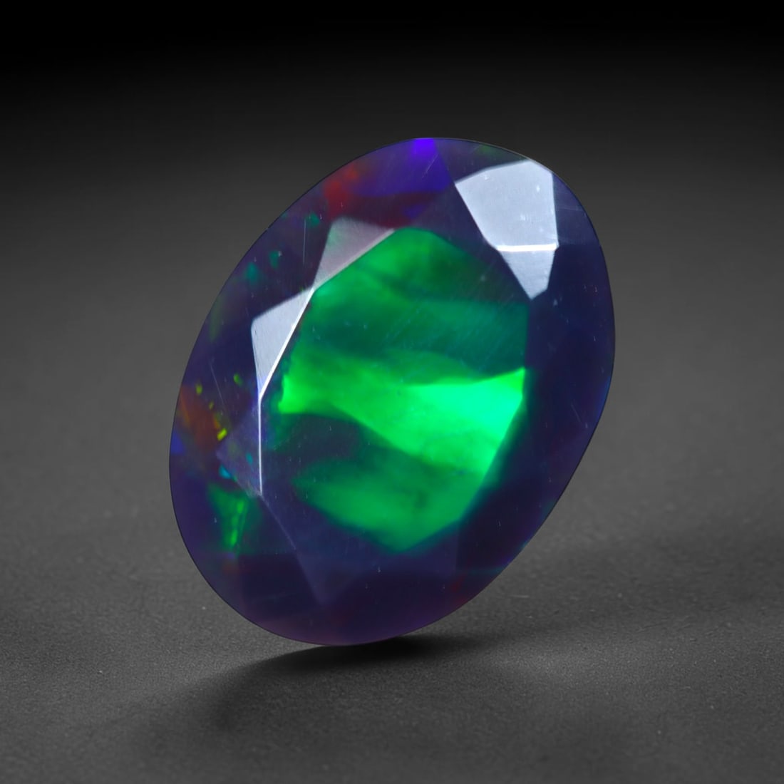 2.00Ct Natural Smoked Ethiopian Black Opal, Faceted Cut - 11.8x8.6x4.6 mm , 720C: Ksmith Heritage Auctioneers Subject: Natural Ethiopian Welo Opal Origin: Ethiopia Treatment: Smoked