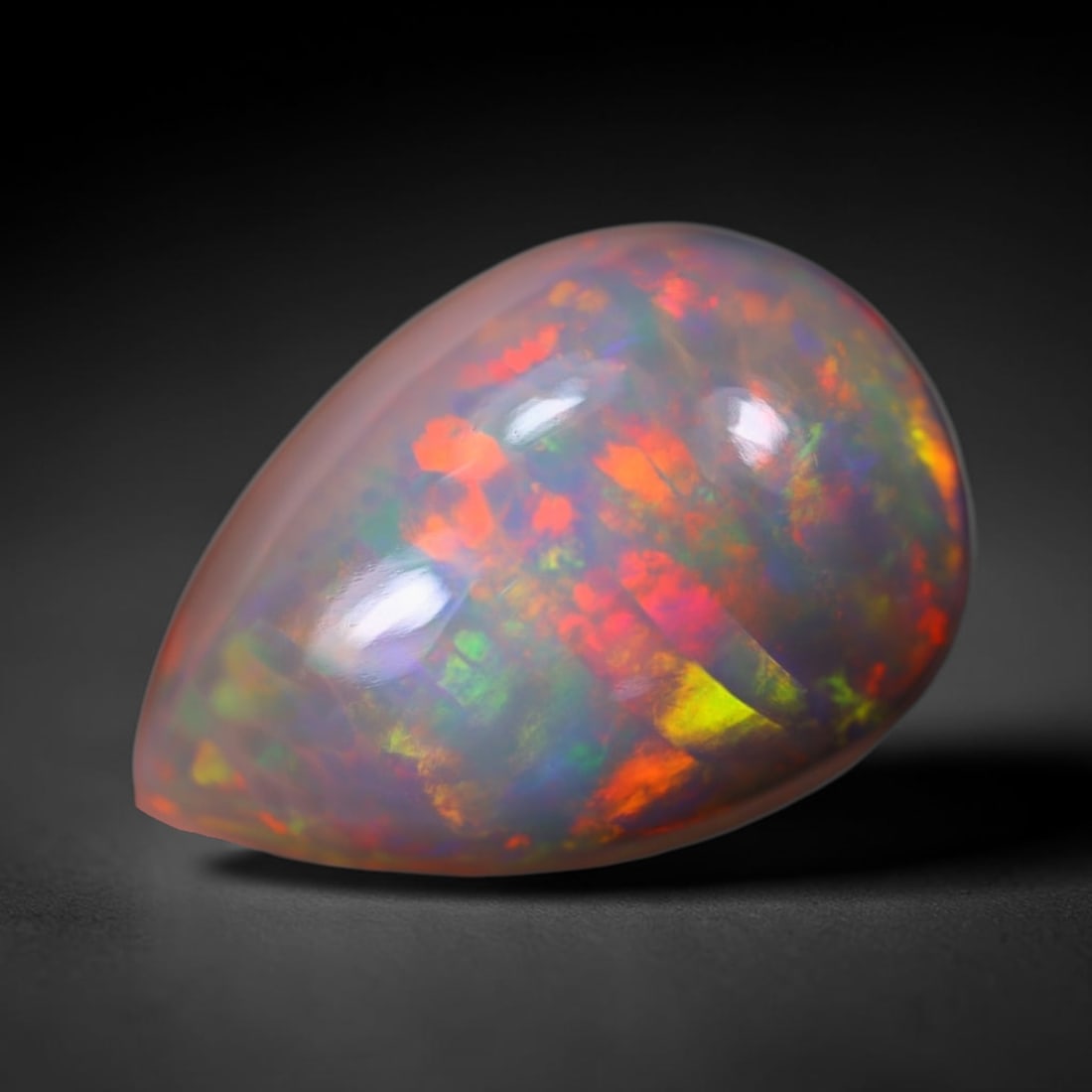 *8.77Ct Welo Opal Polished - Ethiopian Opal, 295B: Ksmith Heritage Auctioneers Subject: Natural Ethiopian Welo Opal Origin: Ethiopia Carat Weight: 8.77Ct Dimension: 18.1x12.6x8.3 mm Treatment: Natural Untreated Type: Cabochon,