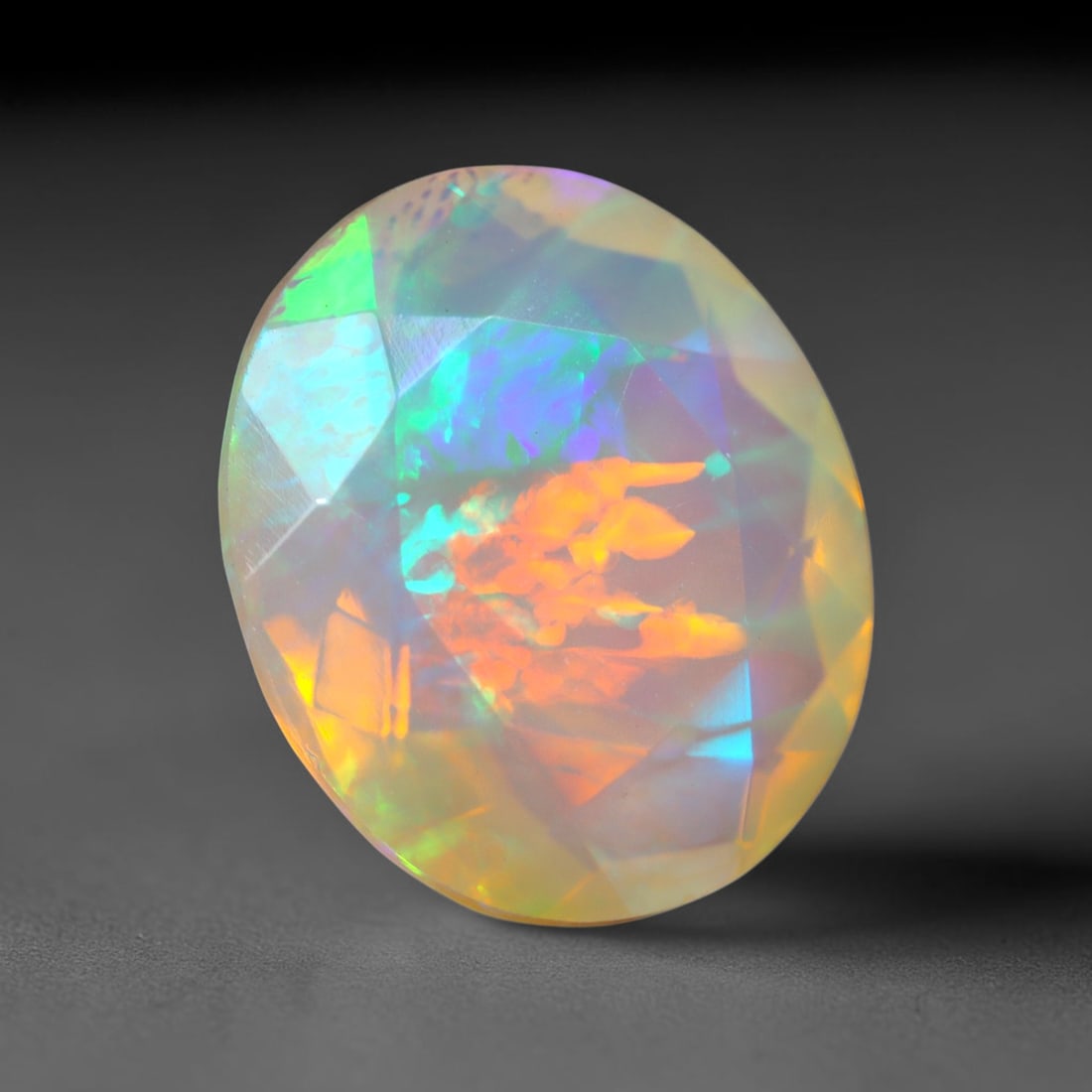 3.25Ct Natural Ethiopian Opal, Faceted Cut - 12.0x10.0x6.1 mm , 645C: Ksmith Heritage Auctioneers Subject: Natural Ethiopian Welo Opal Origin: Ethiopia Treatment: Unheated