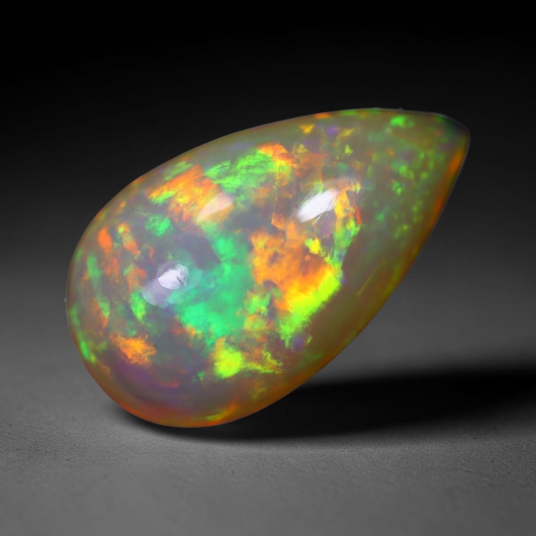 *5.82Ct Welo Opal Polished - Ethiopian Opal , 206E: Ksmith Heritage Auctioneers Subject: Natural Ethiopian Welo Opal Origin: Ethiopia Carat Weight: 5.82Ct Dimension: 17.7x10.5x6.4 mm Treatment: Natural Untreated Type: Caboc