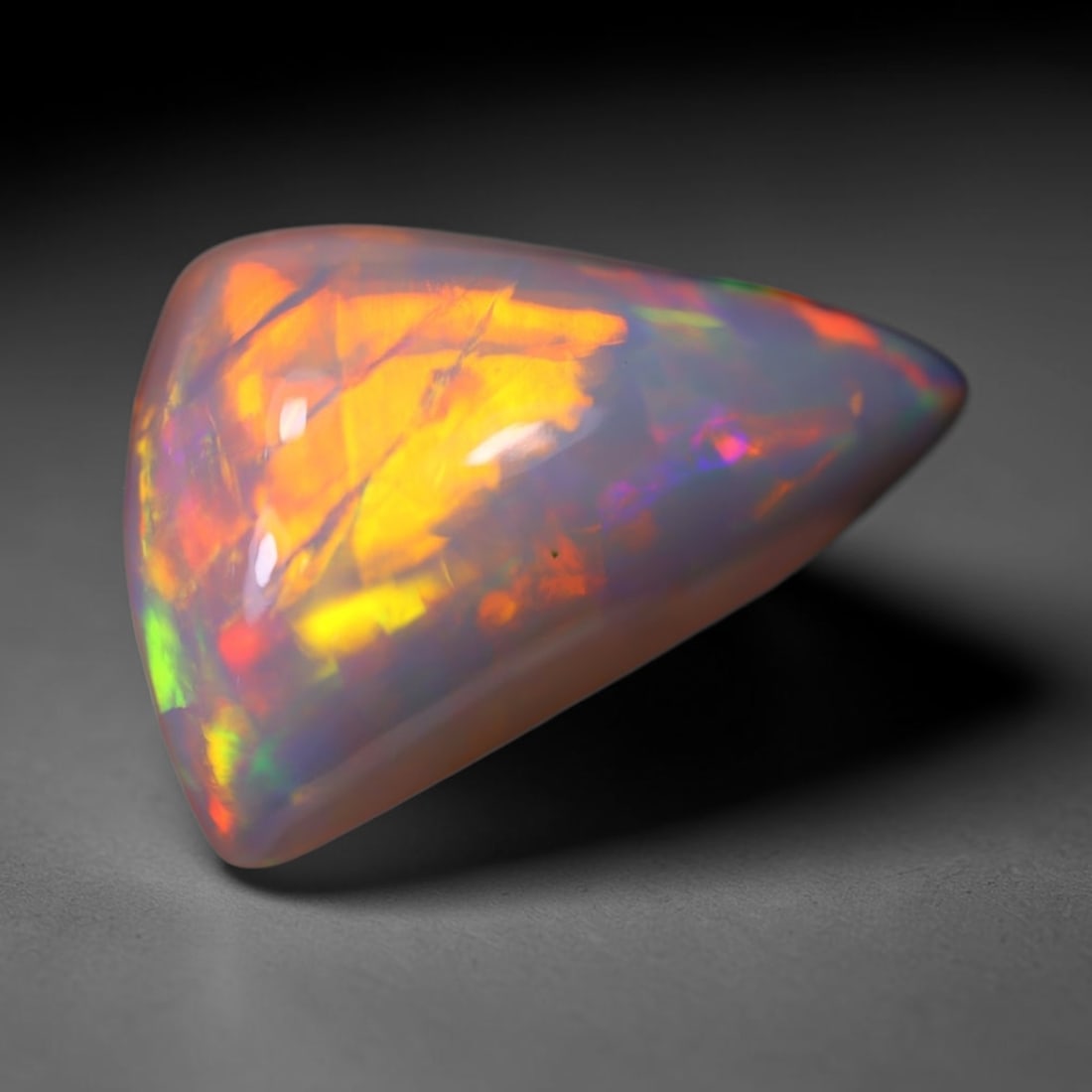 *8.19Ct Welo Opal Polished - Ethiopian Opal, 813B: Ksmith Heritage Auctioneers Subject: Natural Ethiopian Welo Opal Origin: Ethiopia Carat Weight: 8.19Ct Dimension: 18.6x11.4x8.6 mm Treatment: Natural Untreated Type: Cabochon,