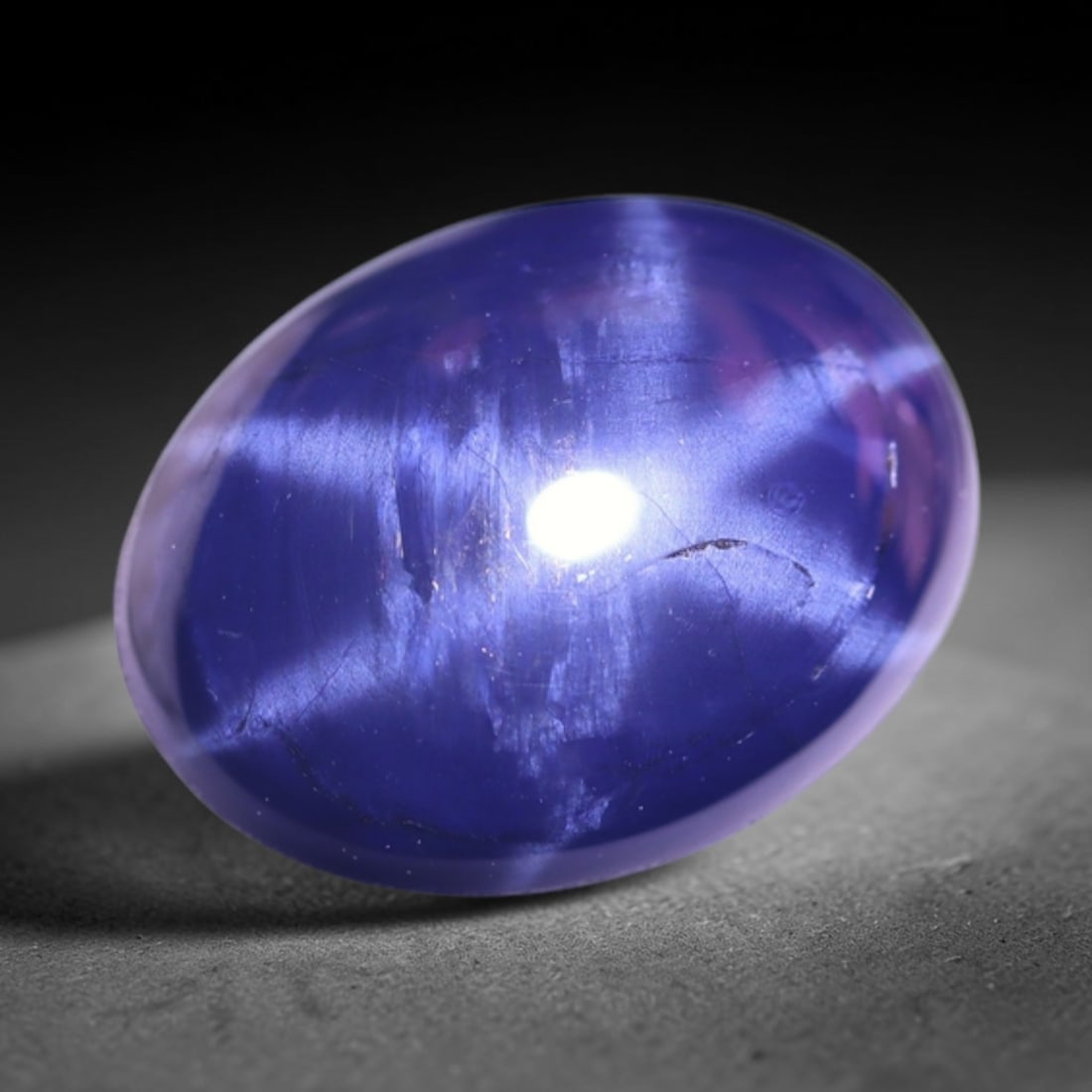 2.44Ct 6 Rays Blue Star Sapphire - Polished Cabochon , 975E: Ksmith Heritage Auctioneers Subject: Natural 6 Rays Star Sapphire Origin: Myanmar Carat Weight: 2.44Ct Dimension: 9.2x6.9x3.5 mm Treatment: Diffusion Type: Cabochon, Polis