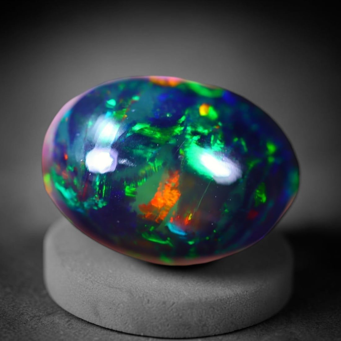 *8.50Ct Welo Black Opal Polished - Ethiopian Opal - Oval Cabochon , 61E: Ksmith Heritage Auctioneers Subject: Natural Ethiopian Welo Black Opal Origin: Ethiopia Carat Weight: 8.50Ct Dimension: 16.8 x 12.4 x 8 mm Treatment: Smoked Shape: Oval