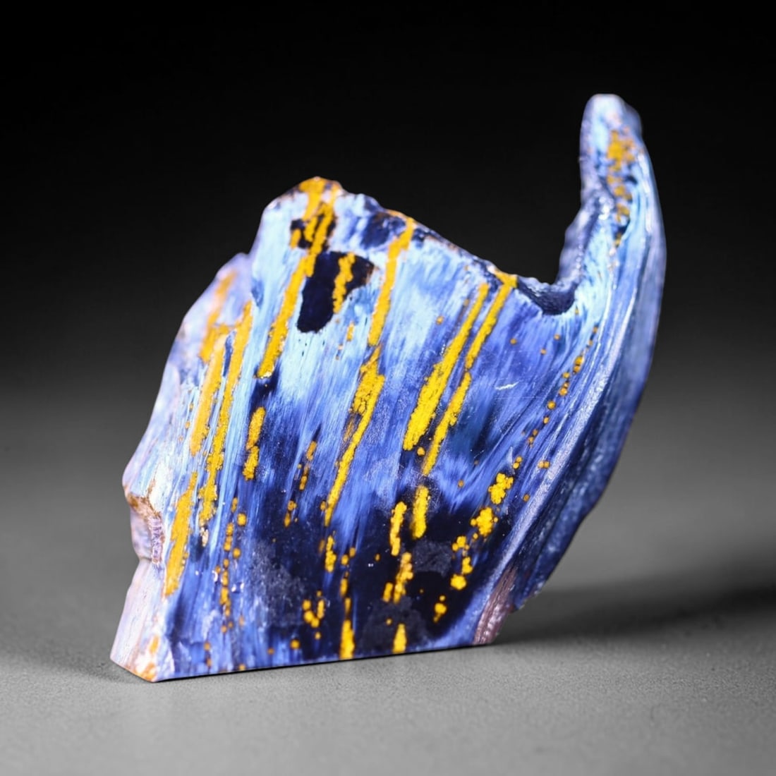 46.23Ct Pietersite Slab - Gemstone Crystal - Freeform Slice, 195B: Ksmith Heritage Auctioneers Subject: Natural Pietersite Origin: Namibia, South Africa Carat Weight: 46.23Ct Dimension: 42.7 x 27.7 x 5.3 mm Treatment: Natural Untreated Shape: Freeform Type:Slab