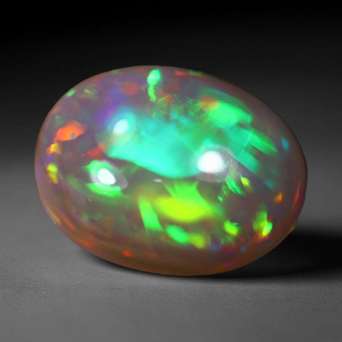 *5.23Ct Welo Opal Polished - Ethiopian Opal , 393C: Ksmith Heritage Auctioneers Subject: Natural Ethiopian Welo Opal Origin: Ethiopia Carat Weight: 5.23Ct Dimension: 14.5x11.1x6.1 mm Treatment: Natural Untreated Type: Caboc